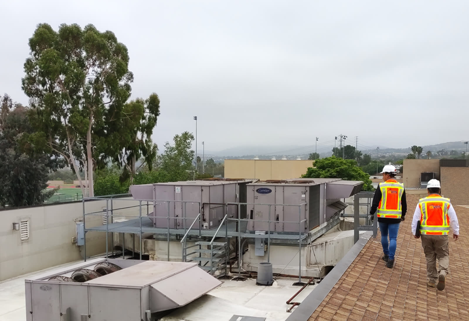 3DVES team inspecting rooftop HVAC units on site
